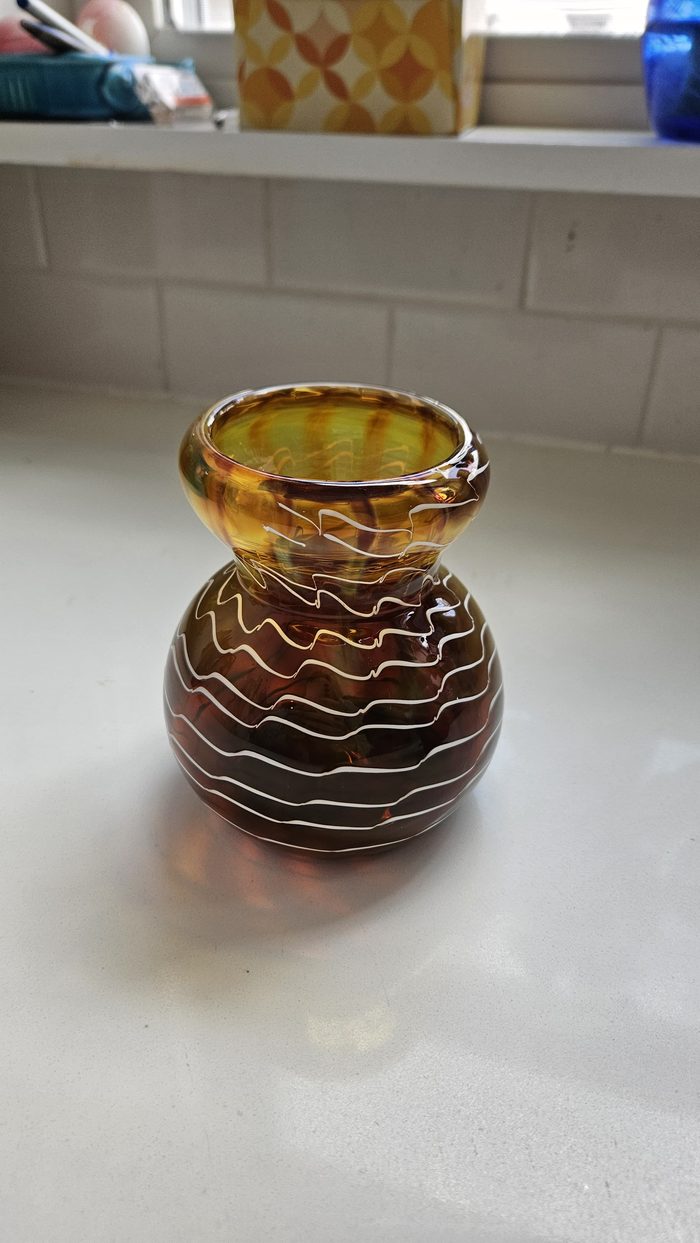 Amber glass vase with white wavy lines
